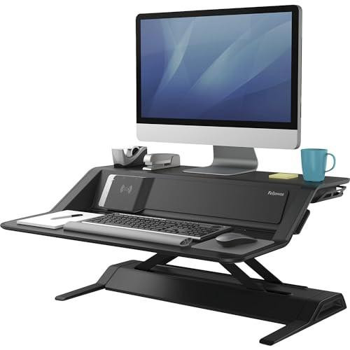 Fellowes Lotus DX Deluxe Height Adjustable Sit-Stand Workstation, Black, 8081001, featuring a computer monitor, keyboard, and accessories on a versatile, ergonomic desk suitable for adjustable sitting and standing work positions.