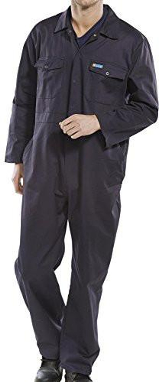 Beeswift PCBSN34 CLICK BOILERSUIT NAVY BLUE 34, a navy blue click boilersuit worn by a man, featuring a front zipper, collar, and multiple pockets for workwear.