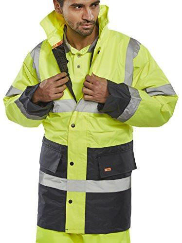TWO TONE TRAFFIC JACKET SATURN YELLOW / NAVY L, front view of a male model wearing the high-visibility safety jacket with yellow and navy blue colors, reflective strips, and multiple pockets for safety and practicality.