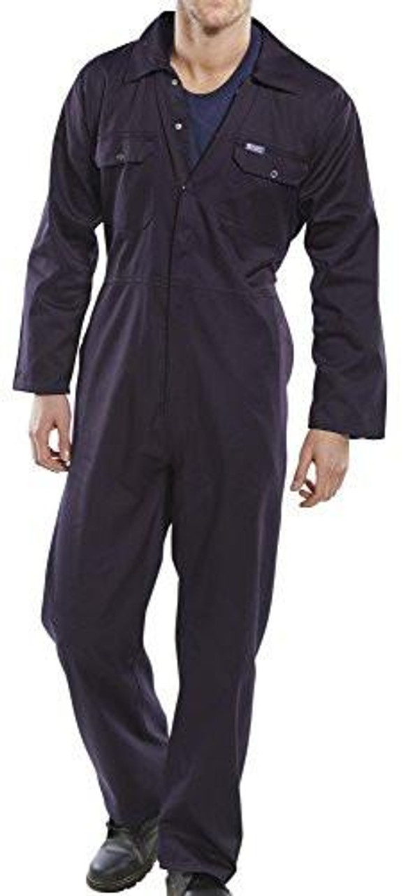 CLICK Regular Boilersuit Navy Blue 54, full-length view of a man wearing a navy blue coverall with front pockets and a button-up front, suitable for industrial or workwear use.