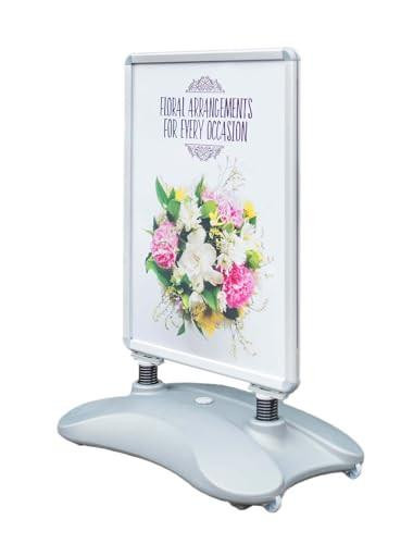 Deflecto A1 Water Based Pavement Display Stand with Snap Frame, freestanding A1 display board with a floral arrangement and notice for occasions.