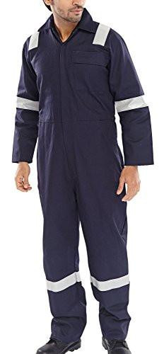 FIRE RETARDANT NORDIC DESIGN BOILERSUIT NAVY 46, a man wearing a navy blue fire retardant boilersuit with reflective white stripes on the sleeves and legs, standing against a plain background.