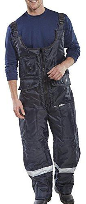 COLDSTAR FREEZER BIB TROUSERS NAVY BLUE XXL, navy blue insulated bib trousers with adjustable shoulder straps and reflective strips at the ankles for cold weather workwear.