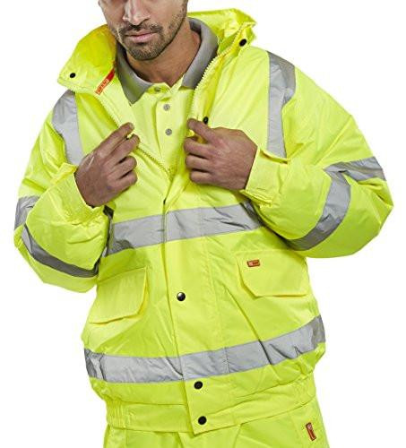 CONSTRUCTOR BOMBER JACKET SATURN YELLOW XXXL, bright yellow safety jacket with reflective silver stripes and multiple pockets, worn by a man adjusting the collar.