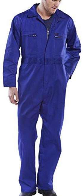 SUPER CLICK HEAVY WEIGHT BOILERSUIT ROYAL BLUE 40, a man wearing a full-length, durable royal blue boiler suit with front zipper and multiple pockets, designed for heavy-duty work.