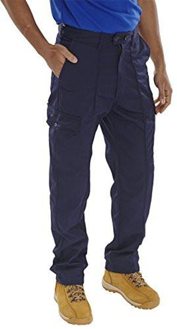 SUPER CLICK DRIVERS TROUSERS NAVY BLUE 32, full-length navy blue work trousers with multiple pockets and a relaxed fit, worn with a blue shirt and tan work shoes.