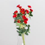 An artificial bunch of red buttercups.