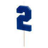 A building block patterned blue candle in the shape of a number 2