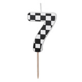 A checkered flag patterned black & white candle in the shape of a number 7