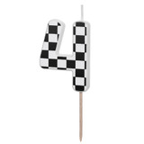A checkered flag patterned black & white candle in the shape of a number 4