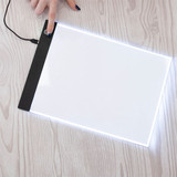 A LED light pad for crafting, manufactured by Crafter's Companion.