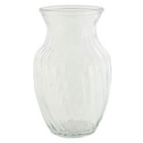 A clear glass sweet pea vase