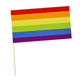 A paper flag with rainbow stripes, manufactured by Hootyballoo.