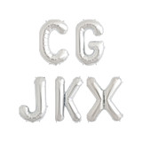 A bargain box containing 16 inch silver letter balloons.