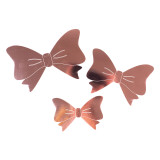 A pack of 12 metallic rose gold 3D bow adhesive decorations, manufactured by Oaktree.