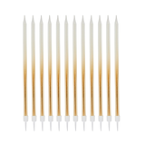 A pack of 12 Gold Ombre Tall Skinny Candles, manufactured by Hootyballoo.
