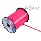 A 500yd spool of Deep Cerise Ribbon, manufactured by Eleganza.