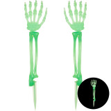 A pair of glow in the dark skeleton hands, manufactured by PartyDeco.