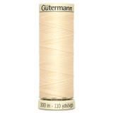 A 100m spool of Cream Sew All Thread, manufactured by Gutermann.