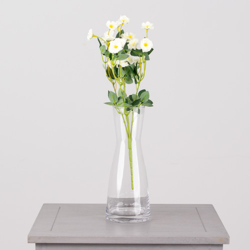 An artificial bunch of ivory buttercups.