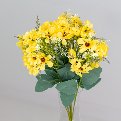 An artificial bunch of yellow daisies. An artificial bunch of yellow daisies.
