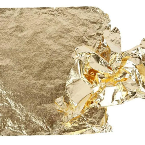 A sheet of gold coloured imitation metal leaf.
