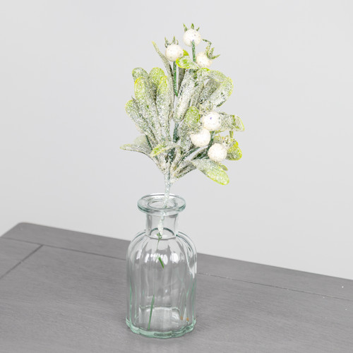A festive pick decoration with glittered mistletoe and berries. A festive pick decoration with glittered mistletoe and berries.