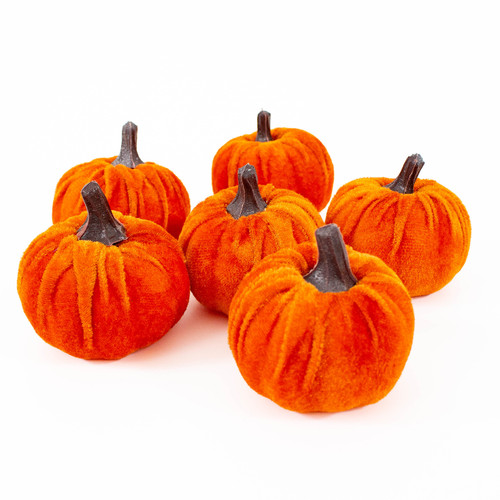A medium burnt orange velvet pumpkin bag.