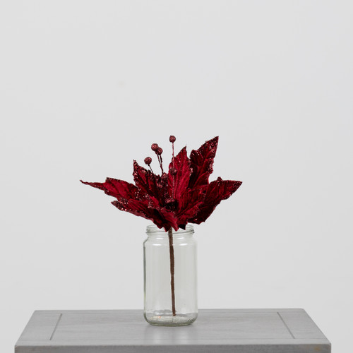 A Burgundy Velvet Poinsettia Pick.