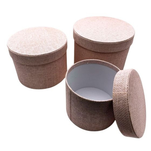 A Set of 3 Light Pink Round Textured Hat Boxes. A Set of 3 Light Pink Round Textured Hat Boxes.
