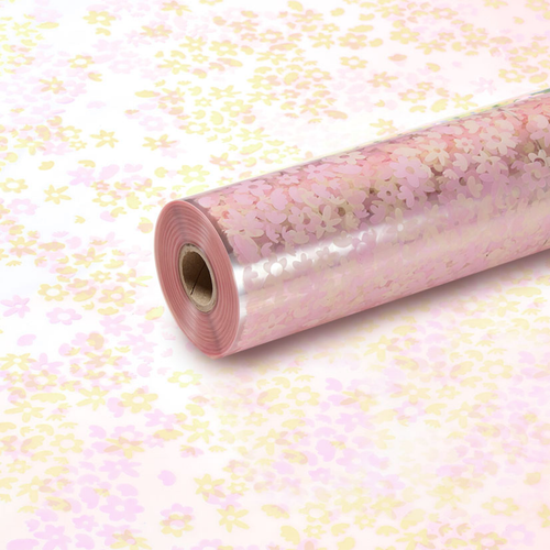 A roll of Light Pink & Beige Flower Confetti Print Clear Film, measuring approx. 80cm x 80m.