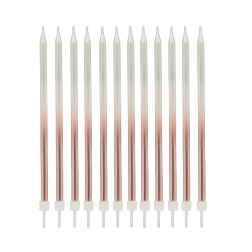 A pack of 12 Rose Gold Ombre Tall Skinny Candles, manufactured by Hootyballoo.
