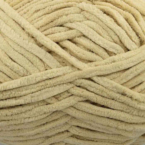 A 200g ball of Warm & Toastie Super Chunky Natural Polyester Yarn, manufactured by King Cole.