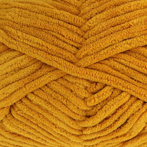 A 200g ball of Warm & Toastie Super Chunky Mustard Polyester Yarn, manufactured by King Cole.
