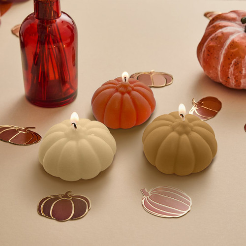 A set of three Pumpkin Candles.