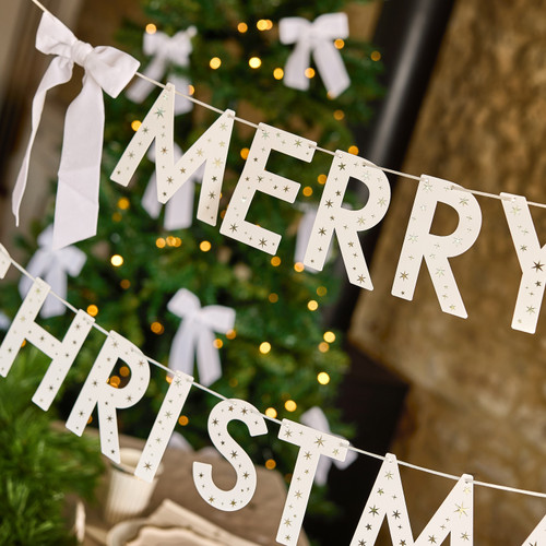 A White Merry Christmas Card Banner with Velvet Bows.