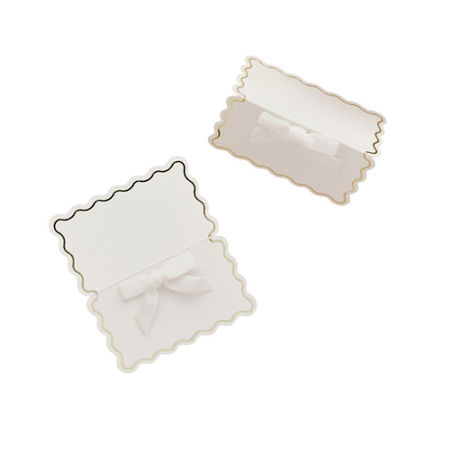 A pack of 8 White & Gold Wavy Edge Place Cards with Velvet Bows.