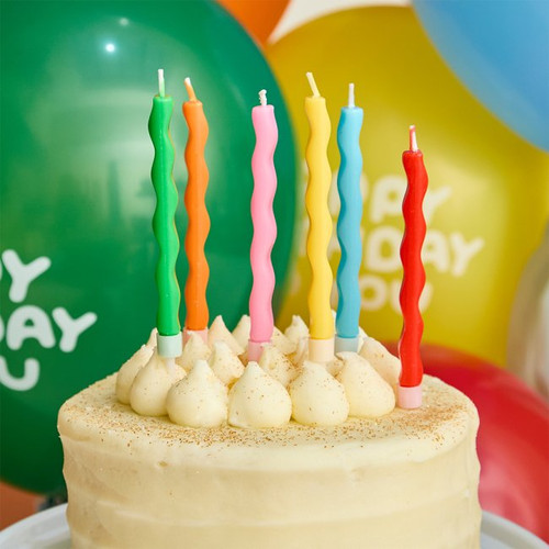 A pack of 12 Playful Brights Wavy Candles.