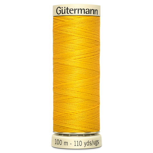 A 100m spool of Goldenrod Sew All Thread, manufactured by Gutermann.