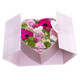 Pink heart shaped box filled with flowers