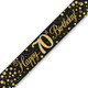 A 70th birthday banner which is black with gold holographic printing, manufactured by Oaktree.