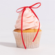 A set of 8 Red Ribbon Bow Cake Toppers, manufactured by PME Cake.