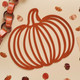 A pack of 4 Orange Pumpkin Felt Place Mats.