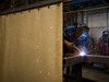 Vermiculite Coated Fiberglass Welding Blanket - In Use as Vertical Welding Curtain