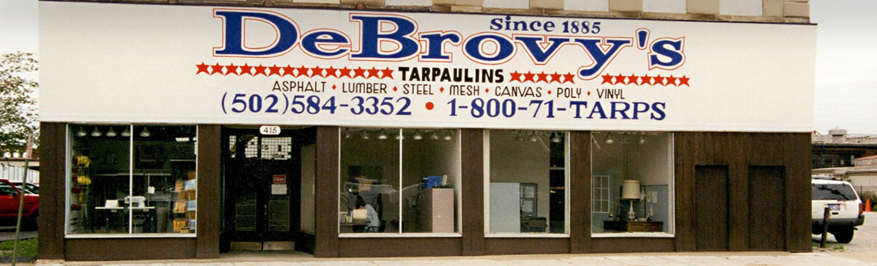 DeBrovy’s storefront in Louisville with large windows, specializing in industrial fabrics and textiles.