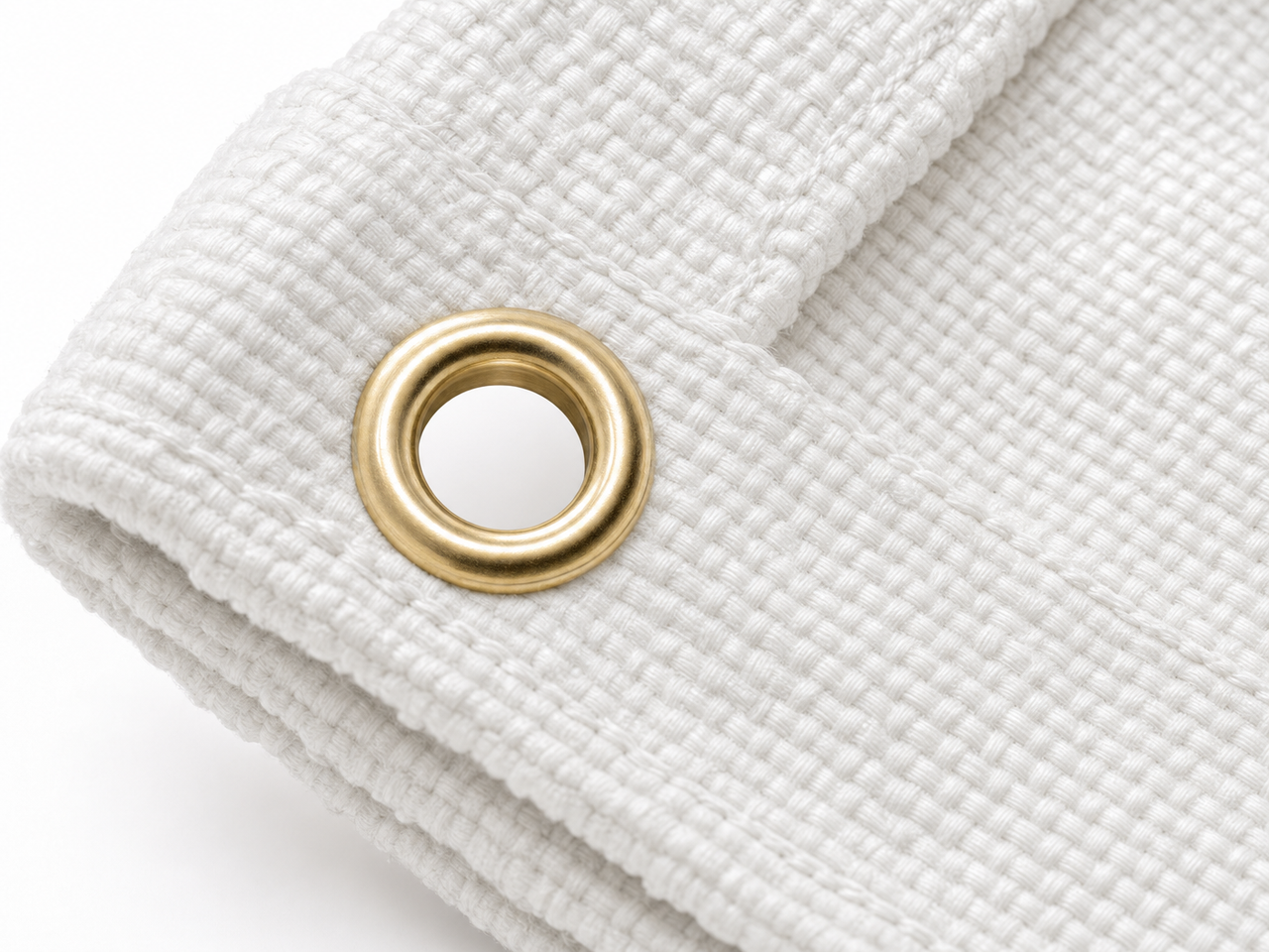 Brass grommet close-up on white fiberglass welding blanket - 24 inch spacing
