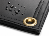 23 oz. Black Slag Shed Fiberglass Welding Blanket - Close-Up of Slag Shed Coating with Cooled Slag Droplets and Brass Grommet