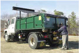 Armless semi-automatic Tuff-Tarper tarp system covering roll-off container