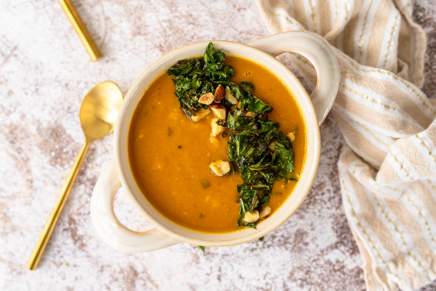White Bean and Pumpkin Soup with Kale Hazelnut Crumble