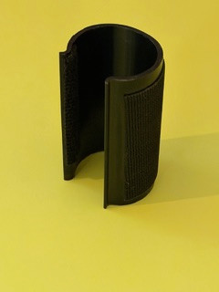 The Burr Clamp attaches to the pocket holster to assist in securing the firearm in the holster.